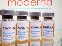 FILE PHOTO: Vials with a sticker reading, "COVID-19 / Coronavirus vaccine / Injection only" and a medical syringe are seen in front of a displayed Moderna logo in this illustration taken October 31, 2020. REUTERS/Dado Ruvic/Illustration/File Photo